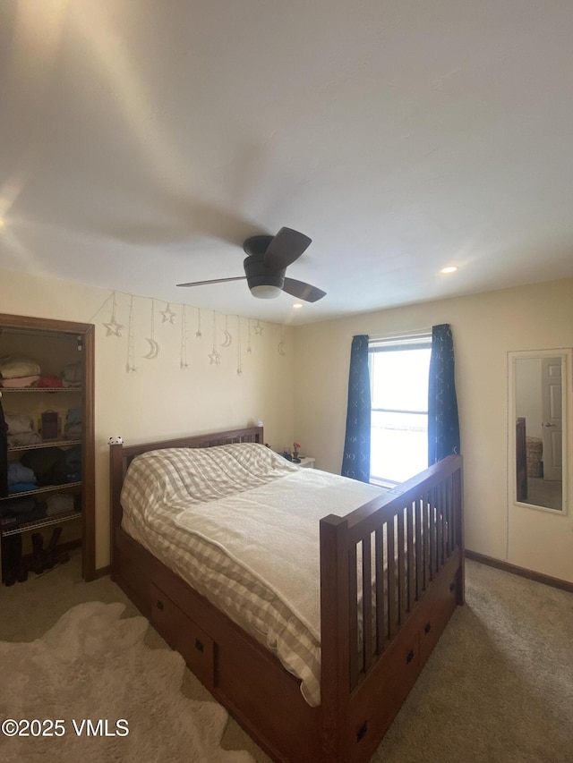 carpeted bedroom featuring ceiling fan