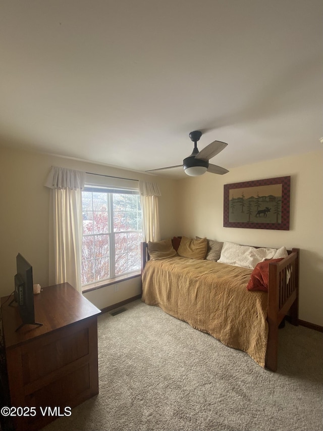 bedroom with ceiling fan and carpet floors