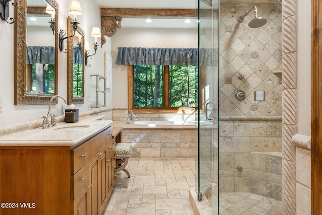 bathroom with vanity and separate shower and tub