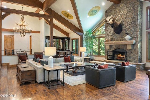 living room with beamed ceiling, dark hardwood / wood-style floors, a notable chandelier, and a fireplace