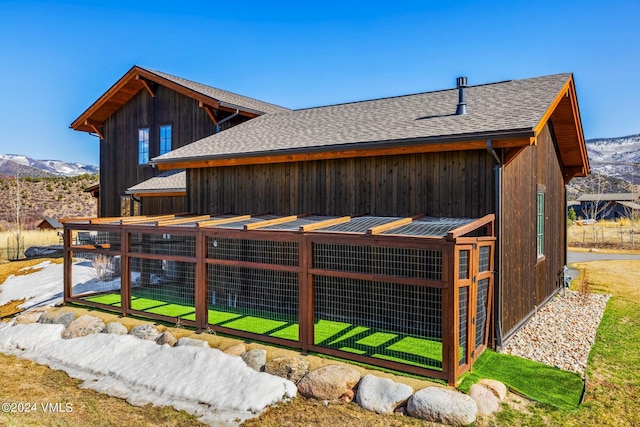367 Hunters View Ln, Eagle, CO 81631 - view of side of property with a shingled roof, exterior structure, a mountain view, and an outdoor structure