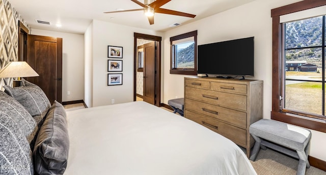 367 Hunters View Ln, Eagle, CO 81631 - bedroom featuring multiple windows, baseboards, and a ceiling fan