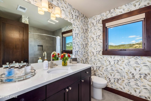 367 Hunters View Ln, Eagle, CO 81631 - bathroom with wallpapered walls, toilet, a shower with shower curtain, and vanity