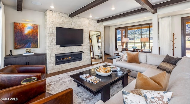367 Hunters View Ln, Eagle, CO 81631 - living area with beamed ceiling, a fireplace, plenty of natural light, and wood finished floors