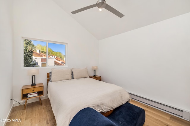 bedroom with baseboard heating, light wood-style flooring, high vaulted ceiling, and ceiling fan