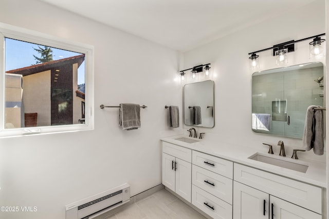 full bath with a baseboard radiator, a stall shower, double vanity, and baseboards