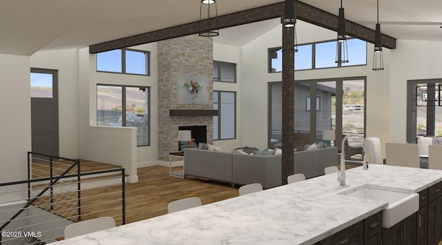 2332 Fox Ln, Avon, CO 81620 - dining area featuring wood finished floors, beamed ceiling, high vaulted ceiling, baseboards, and a fireplace
