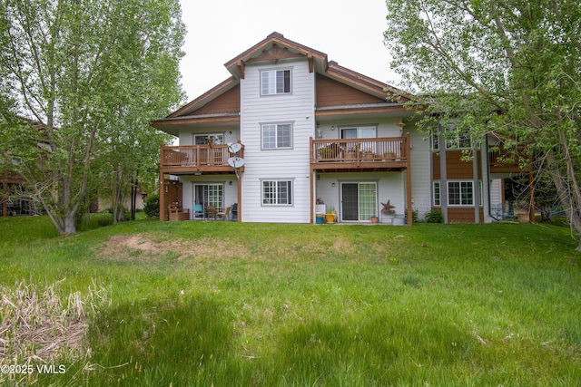 1404 Crazy Horse Cir Unit 1404, Edwards, CO 81632 - back of property featuring a lawn