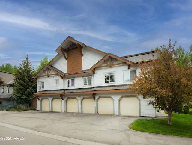 1404 Crazy Horse Cir Unit 1404, Edwards, CO 81632 - multi unit property featuring driveway, a garage, and a shingled roof