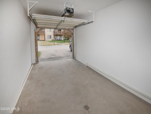 1404 Crazy Horse Cir Unit 1404, Edwards, CO 81632 - garage with a baseboard radiator and a garage door opener