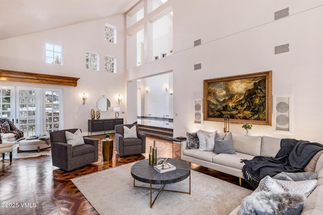 living room featuring vaulted ceiling and visible vents