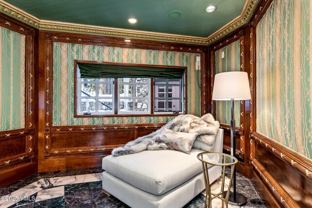 living area featuring recessed lighting, marble finish floor, wainscoting, and wallpapered walls