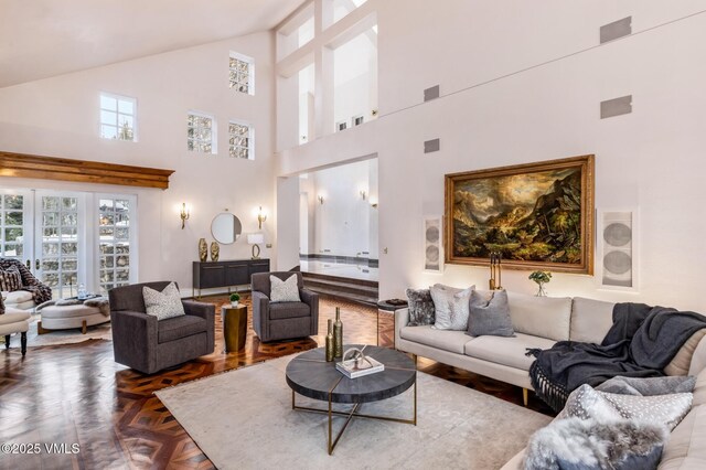 living area featuring visible vents and lofted ceiling