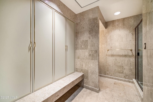 full bath with recessed lighting and a shower stall