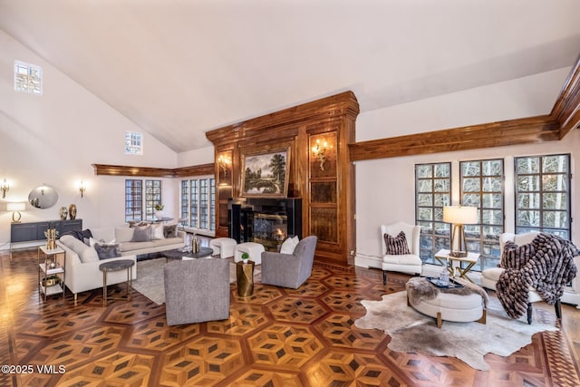 living room with a fireplace and high vaulted ceiling