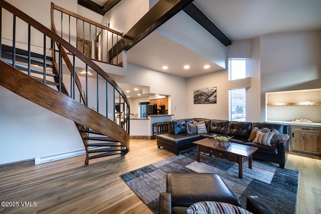 508 E Lionshead Cir Unit 502, Vail, CO 81657 - living area featuring a high ceiling, light wood finished floors, stairway, and recessed lighting