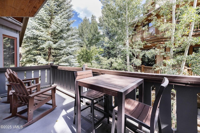 627 Sawatch Dr Unit 302, Edwards, CO 81632 - wooden terrace with outdoor dining space