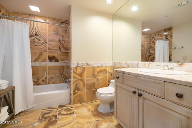 627 Sawatch Dr Unit 302, Edwards, CO 81632 - bathroom featuring tile walls, vanity, shower / bath combination with curtain, recessed lighting, and tile patterned flooring
