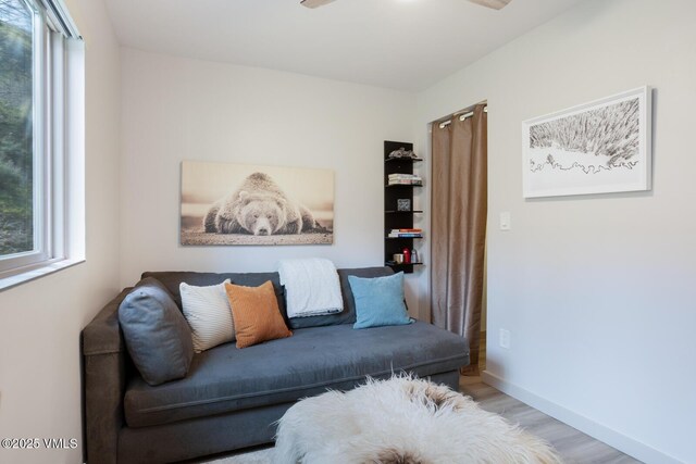 1552 Matterhorn Cir Unit 9, Vail, CO 81657 - sitting room featuring wood finished floors, baseboards, and ceiling fan