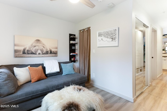 1552 Matterhorn Cir Unit 9, Vail, CO 81657 - living room with light wood-style flooring, a ceiling fan, and baseboards