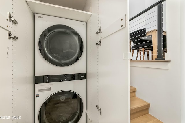 laundry room with laundry area and stacked washer / drying machine