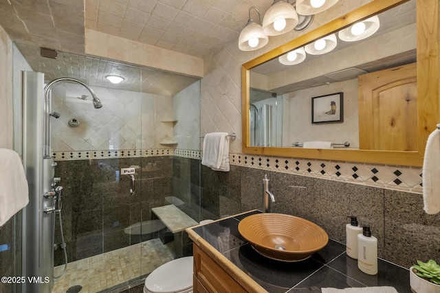 9 Vail Rd Unit 1J, Vail, CO 81657 - full bath with tile walls, a shower stall, and vanity