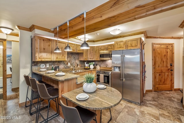 9 Vail Rd Unit 1J, Vail, CO 81657 - kitchen featuring stainless steel appliances, ornamental molding, tasteful backsplash, a peninsula, and decorative light fixtures