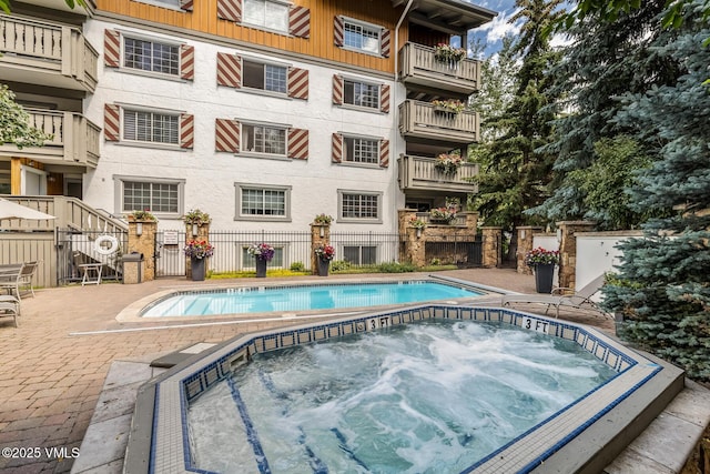 9 Vail Rd Unit 1J, Vail, CO 81657 - view of pool with a hot tub