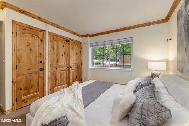 9 Vail Rd Unit 1J, Vail, CO 81657 - carpeted bedroom with ornamental molding and baseboards