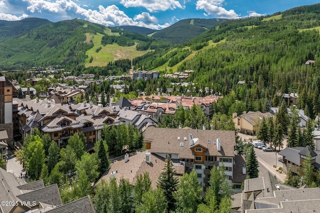 9 Vail Rd Unit 1J, Vail, CO 81657 - aerial overview of property's location featuring a mountain backdrop and nearby suburban area