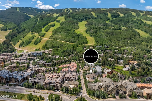 9 Vail Rd Unit 1J, Vail, CO 81657 - aerial view of property's location featuring mountains and nearby suburban area