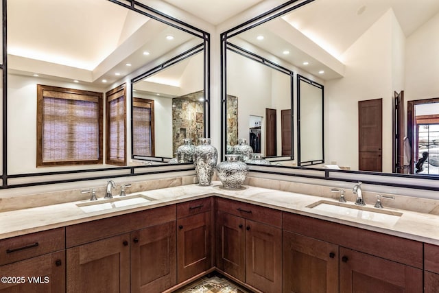 bathroom featuring vanity and high vaulted ceiling