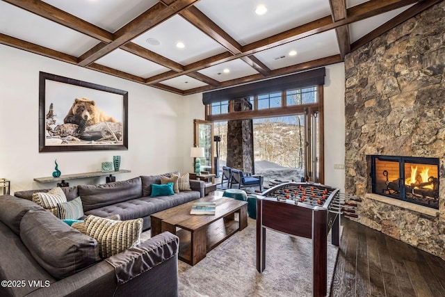 interior space featuring hardwood / wood-style flooring, coffered ceiling, a fireplace, and beam ceiling