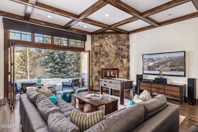 living room featuring hardwood / wood-style flooring, coffered ceiling, a fireplace, and beam ceiling