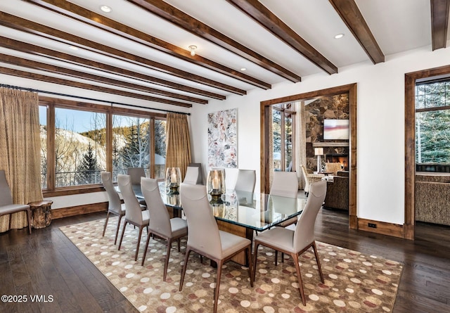 dining space featuring dark hardwood / wood-style floors and beam ceiling