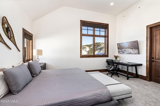 carpeted bedroom featuring vaulted ceiling