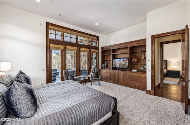 bedroom featuring access to exterior and carpet floors