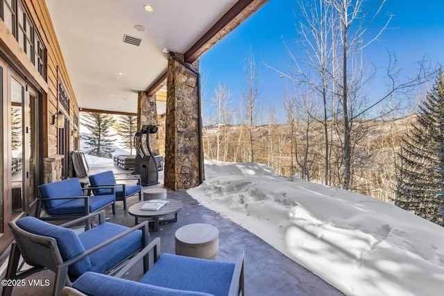 view of snow covered patio