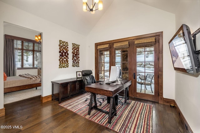 office with high vaulted ceiling, dark hardwood / wood-style floors, and an inviting chandelier