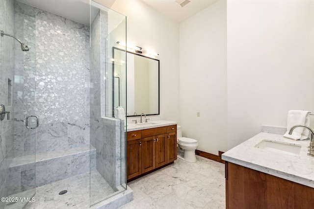 bathroom featuring vanity, toilet, and walk in shower