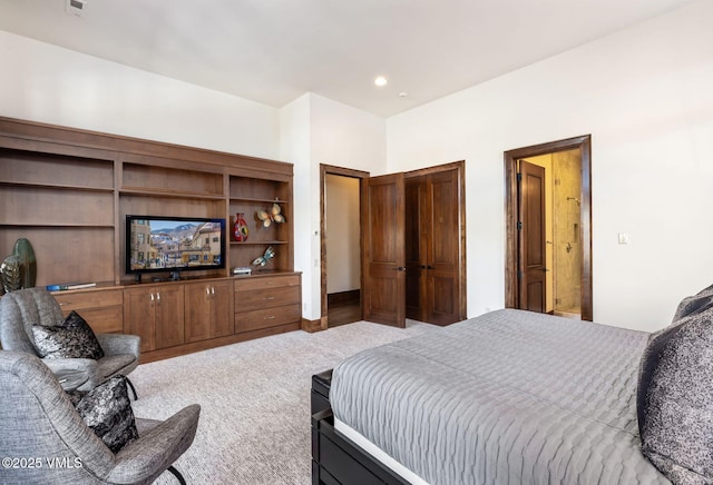 bedroom featuring light carpet