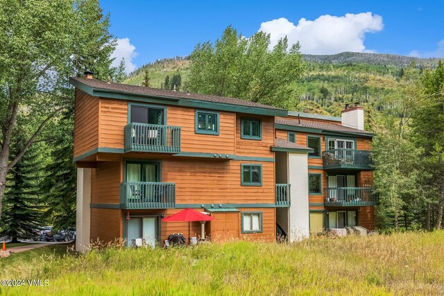 view of building exterior with a mountain view