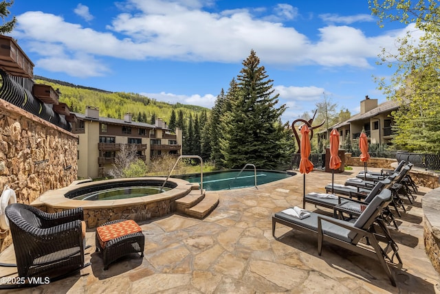 1 Willow Bridge Rd Unit 36, Vail, CO 81657 - view of pool with an in-ground hot tub and a patio