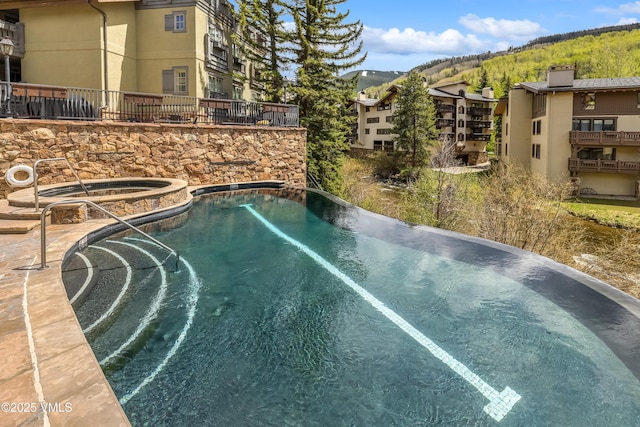 1 Willow Bridge Rd Unit 36, Vail, CO 81657 - view of pool featuring a pool with connected hot tub