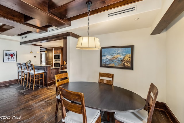 1 Willow Bridge Rd Unit 36, Vail, CO 81657 - dining area with beam ceiling, dark wood finished floors, and baseboards