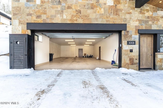 view of snow covered garage