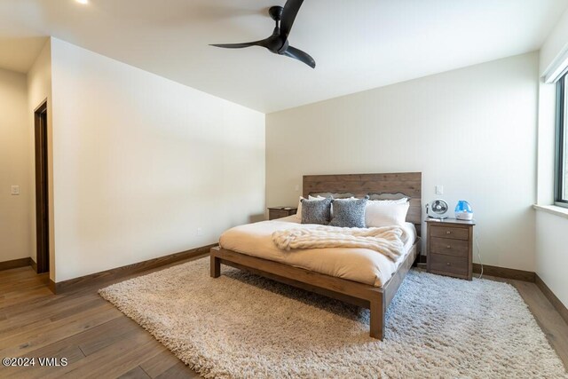 bedroom featuring wood-type flooring and ceiling fan