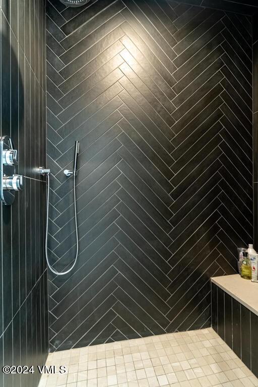 bathroom with tiled shower