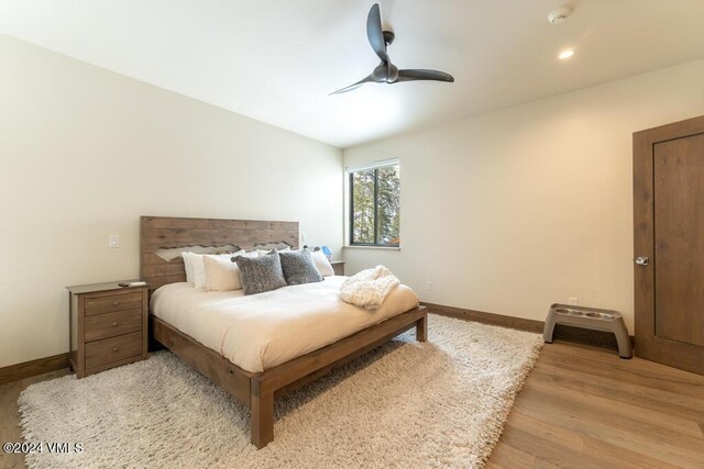 bedroom featuring ceiling fan and light hardwood / wood-style floors