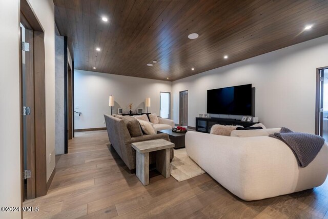 living room featuring wood ceiling and light hardwood / wood-style floors